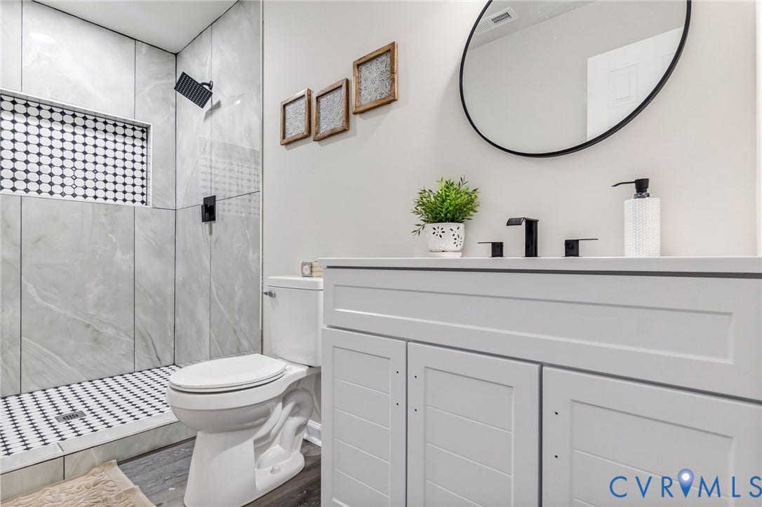 White shaker-style vanity with a light-toned countertop