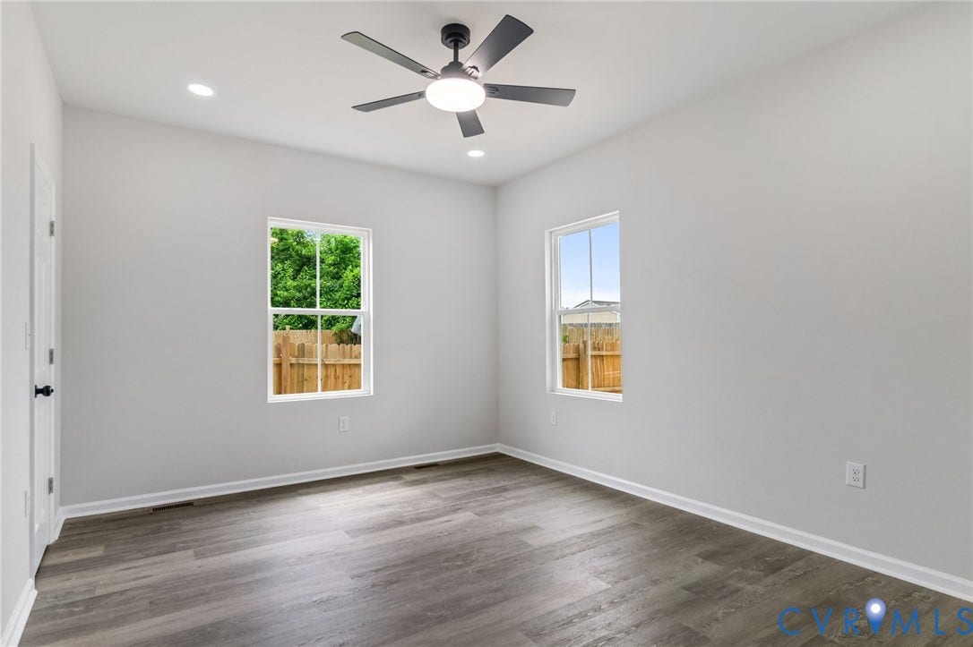 Recessed lighting, ceiling fan with integrated light, wood-finish flooring, and white trim