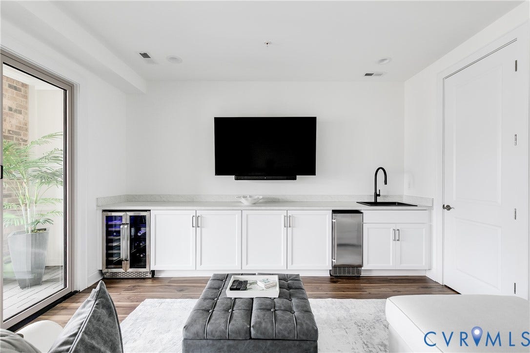 Top Level Media Room with Wet Bar and Nana Wall to Covered Terrace