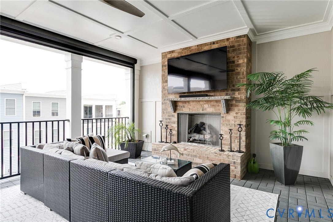 Covered terrace with fireplace and electronic screen