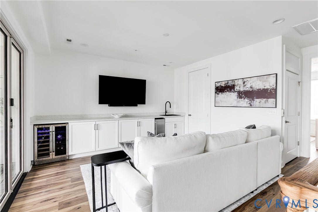 Top Level Media Room with Wet Bar and Nana Wall to Covered Terrace