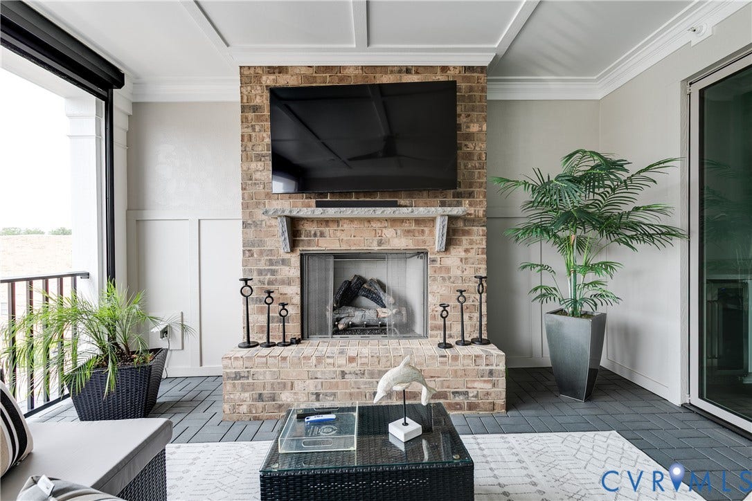 Covered terrace with fireplace and electronic screen