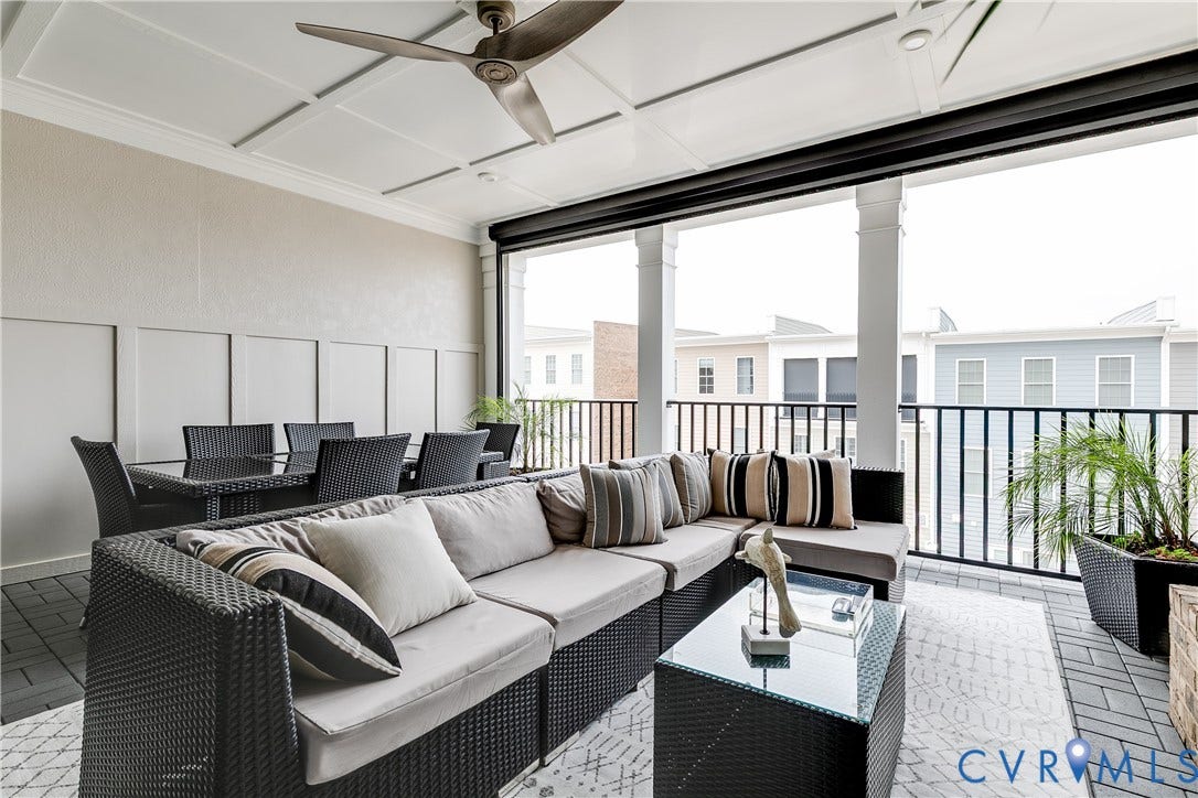 Covered terrace with Nana Wall, fireplace,  and electronic screen