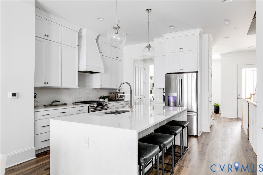Marble waterfall island and SS Appliances