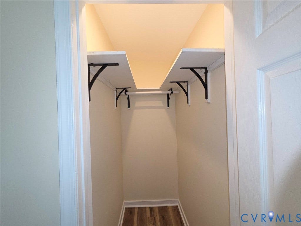 3400 Decatur Street, Richmond, VA 23224 Walk-in closet with integrated shelving, a clothes rod, and wood-finish flooring