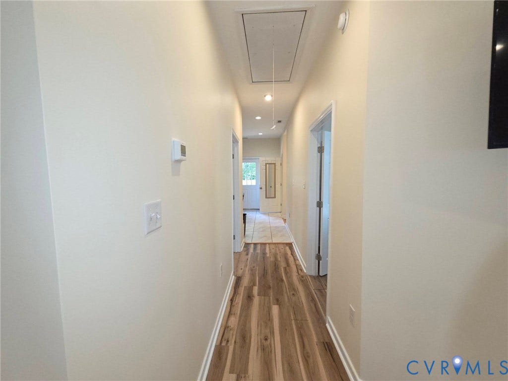 3400 Decatur Street, Richmond, VA 23224 Hallway featuring wood-finish flooring, recessed lighting, and a neutral wall palette