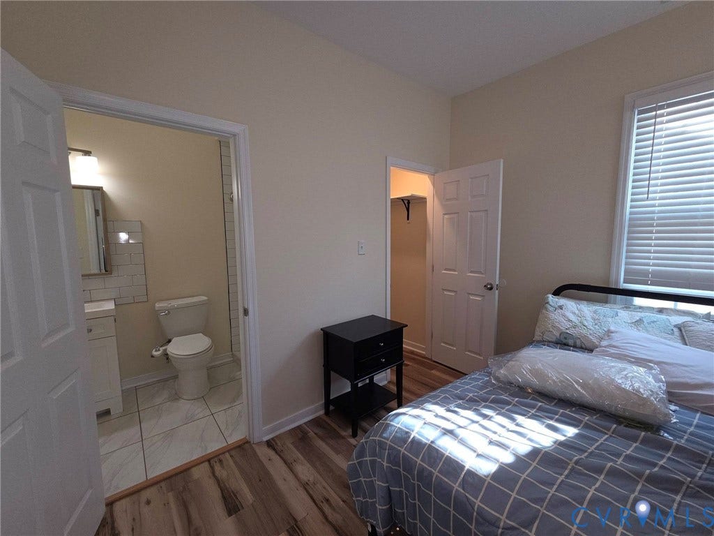 3400 Decatur Street, Richmond, VA 23224 Wood-finish flooring with a white-painted closet door and interior