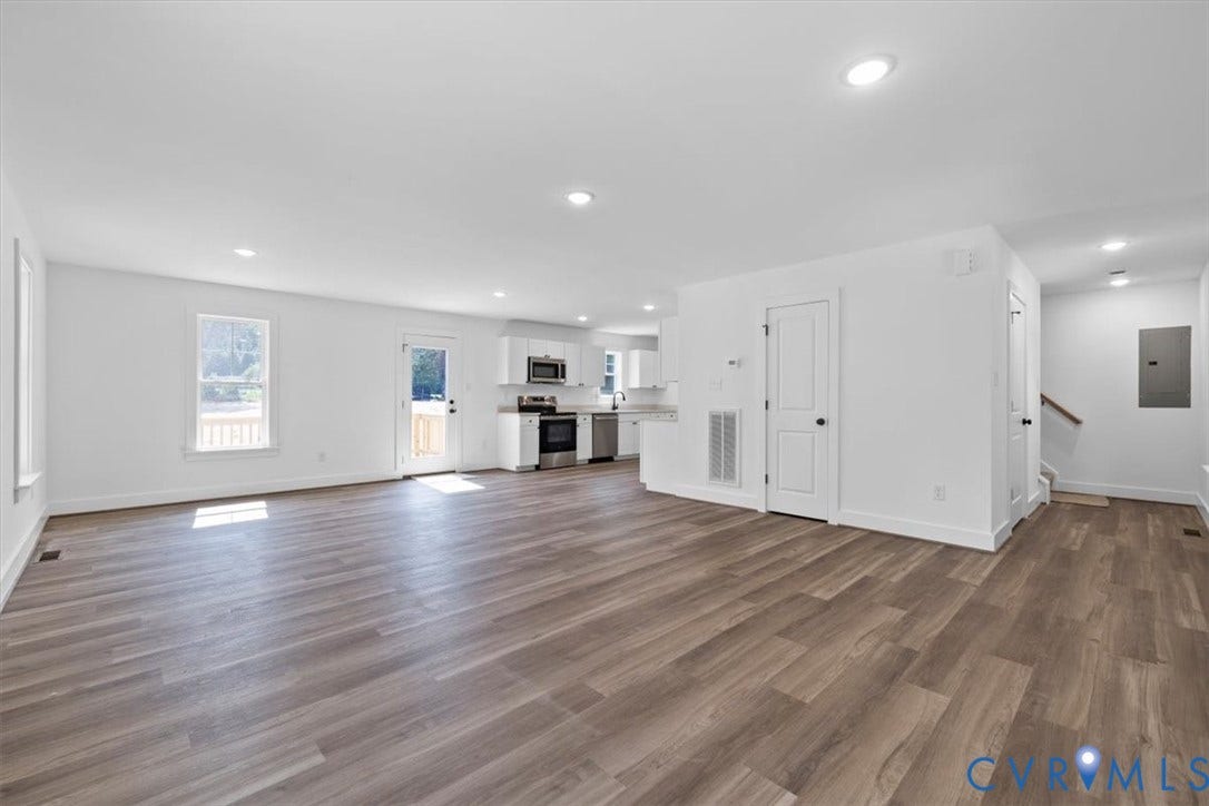 2242 Lakeview Drive, Powhatan, VA 23139 Spacious living area featuring wood-finish flooring, recessed lighting, and white walls