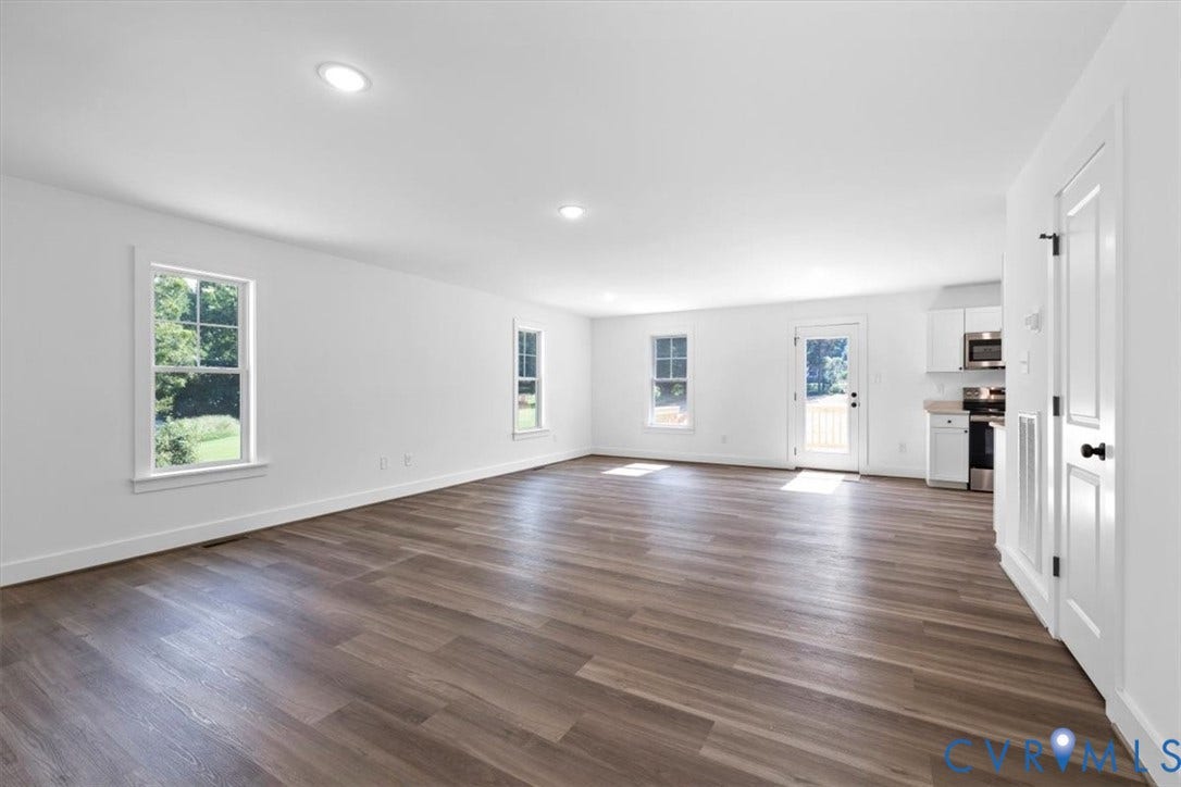 2242 Lakeview Drive, Powhatan, VA 23139 Expansive room featuring wood-finish flooring, recessed lighting, and multiple windows