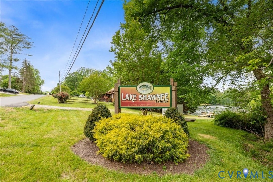 2242 Lakeview Drive, Powhatan, VA 23139 Lake Shawnee Estates signage, mature trees, manicured landscaping, and green lawn