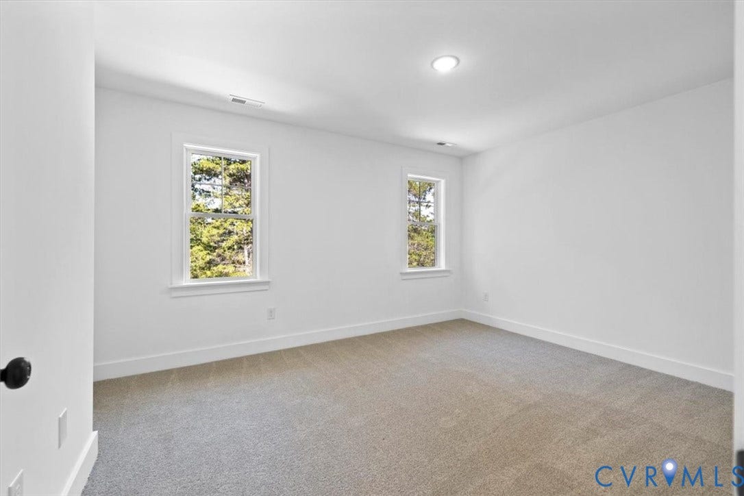 2242 Lakeview Drive, Powhatan, VA 23139 Recessed ceiling light, two windows with white trim, wall-to-wall carpeting, and white walls