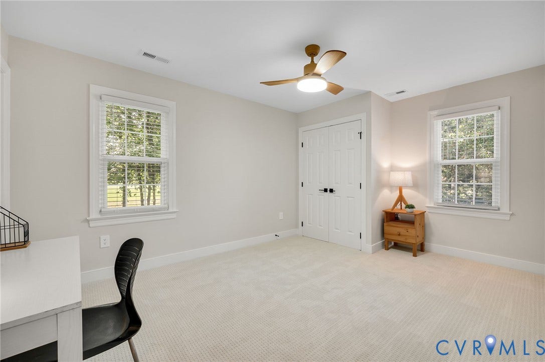 13800 W Salisbury Road, Salisbury, Midlothian, VA 23113 Neutral wall color, carpeted flooring, double-door closet, two windows with blinds, and a ceiling fan with integrated lighting