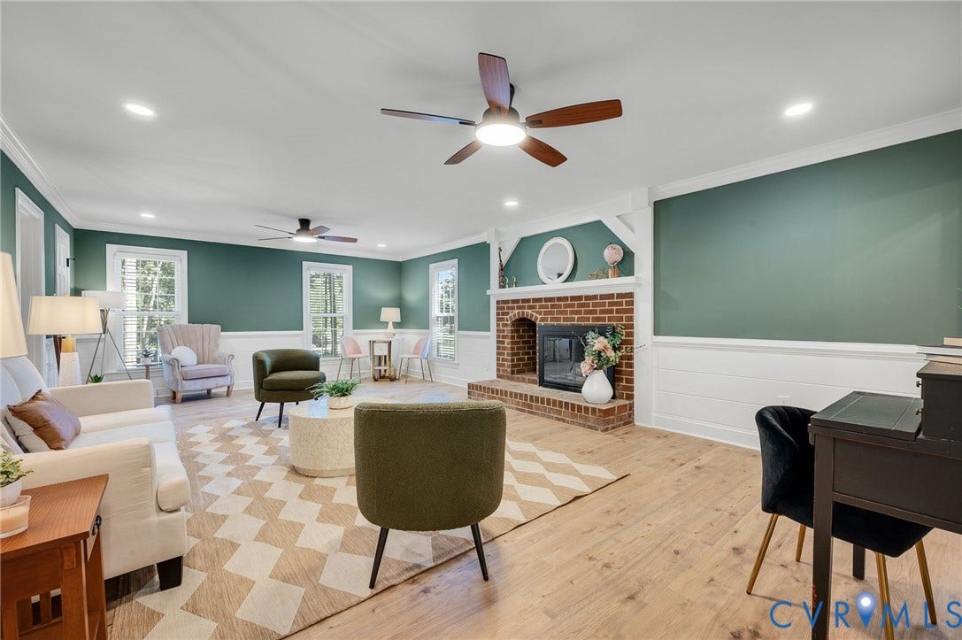 13800 W Salisbury Road, Salisbury, Midlothian, VA 23113 Wood-finish flooring throughout, brick fireplace with a hearth, multiple windows, recessed lighting, and ceiling fans