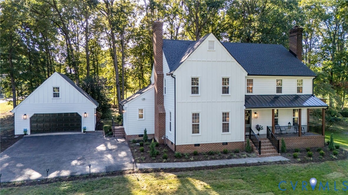 13800 W Salisbury Road, Salisbury, Midlothian, VA 23113 White board and batten exterior with a dark shingle roof