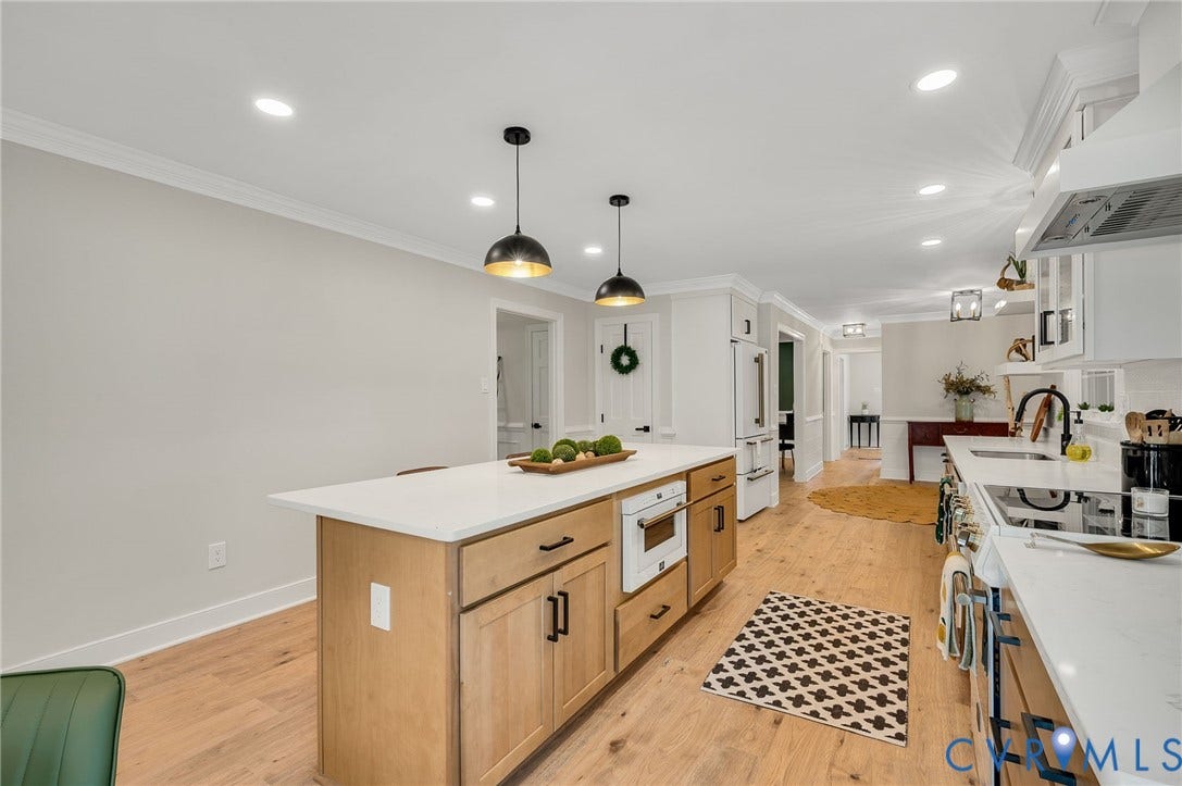 13800 W Salisbury Road, Salisbury, Midlothian, VA 23113 Hardwood flooring, kitchen island with built-in microwave, white countertops, recessed lighting, and pendant lighting