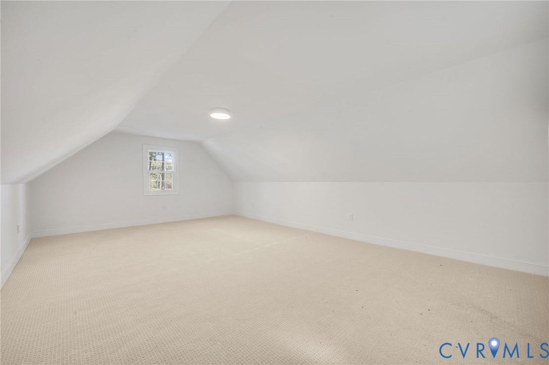 13800 W Salisbury Road, Salisbury, Midlothian, VA 23113 Expansive carpeted room with sloped ceilings, a window, and a flush-mount ceiling light fixture