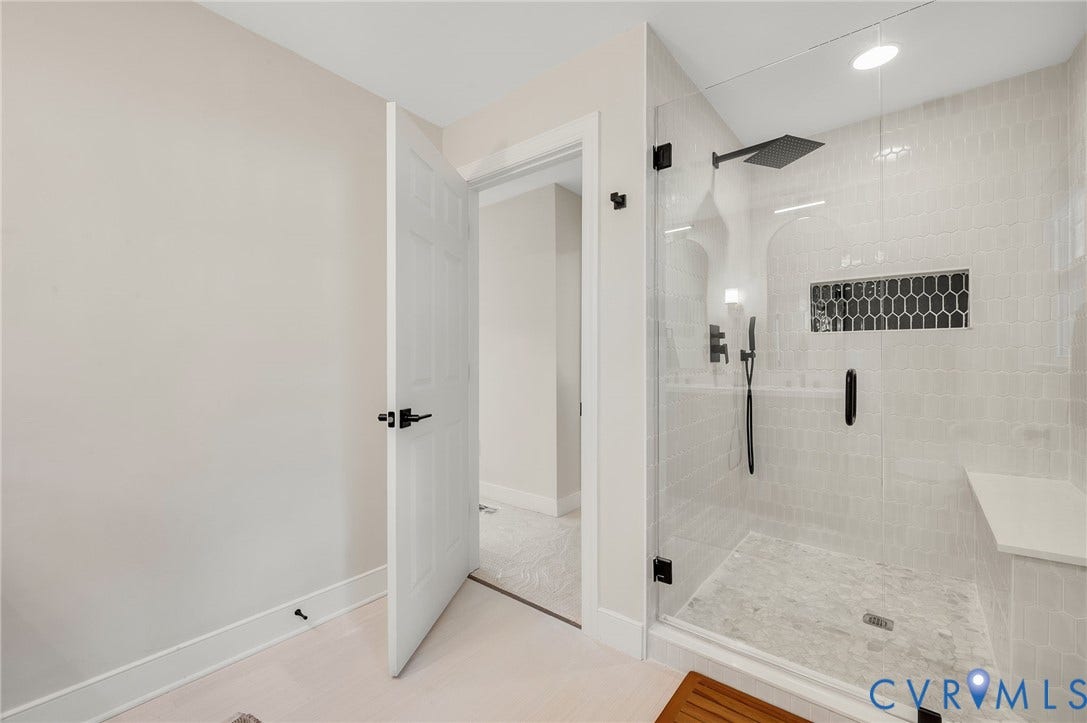 13800 W Salisbury Road, Salisbury, Midlothian, VA 23113 Glass-enclosed shower with matte black fixtures, integrated bench seating, and an accent tiled niche