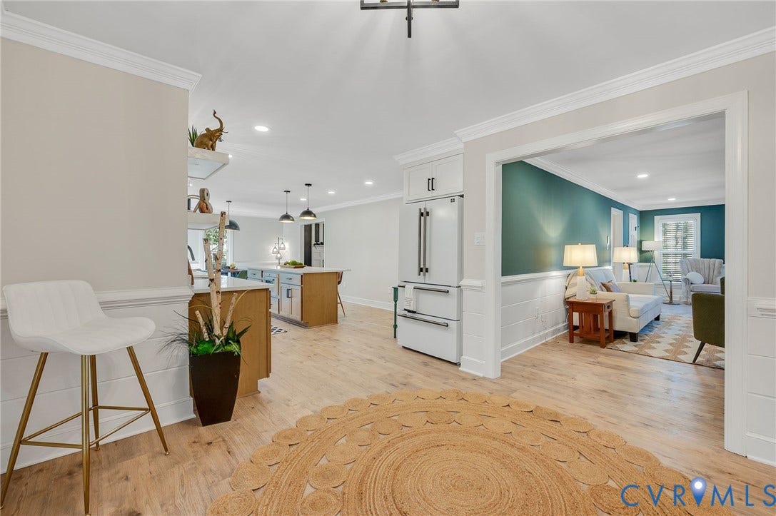 13800 W Salisbury Road, Salisbury, Midlothian, VA 23113 Light wood-finish flooring throughout, white crown molding, recessed lighting, and a built-in refrigerator