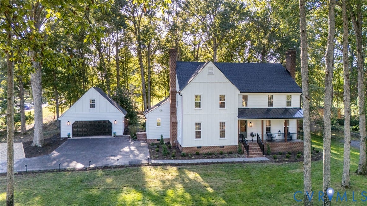13800 W Salisbury Road, Salisbury, Midlothian, VA 23113 Traditional white siding residence featuring a dark roof, brick foundation, and a covered porch with black railings