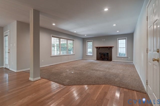 8113 Ainsdale Lane, Chesterfield, VA 23832 Spacious living room with wood burning fireplace, beautifully kept carpet for added warmth