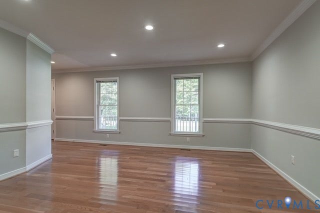 8113 Ainsdale Lane, Chesterfield, VA 23832 Recessed lighting, wood-finish flooring, two windows, crown molding, and chair rail detailing