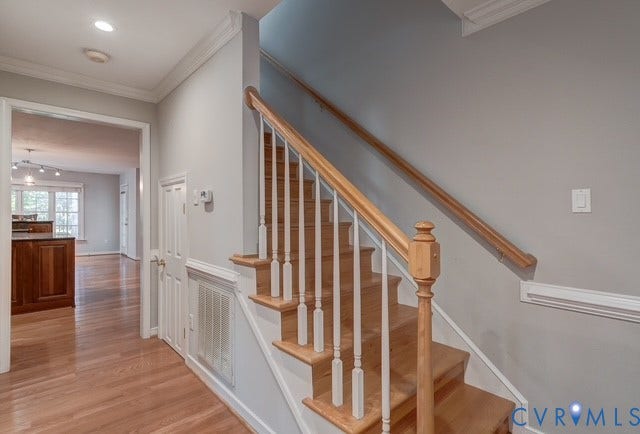 8113 Ainsdale Lane, Chesterfield, VA 23832 Hardwood flooring and staircase with wood railing and white balusters