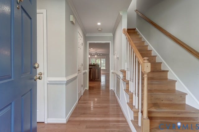 8113 Ainsdale Lane, Chesterfield, VA 23832 Hardwood flooring throughout the entryway, leading to a wooden staircase