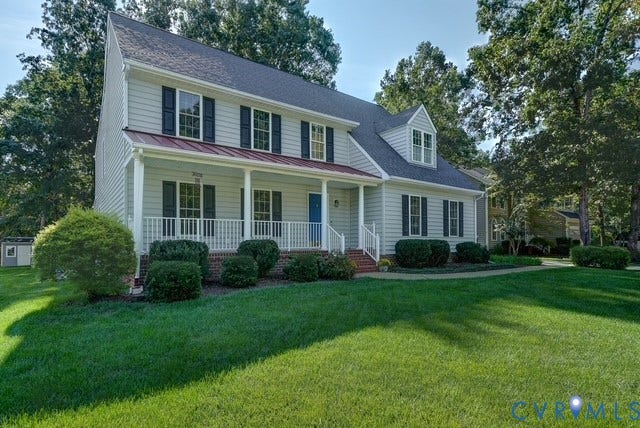 8113 Ainsdale Lane, Chesterfield, VA 23832 Two-story residence featuring light-colored siding and a covered front porch with white railings