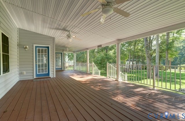 8113 Ainsdale Lane, Chesterfield, VA 23832 Expansive covered deck with wood-finish flooring, multiple ceiling fans, and a white railing system