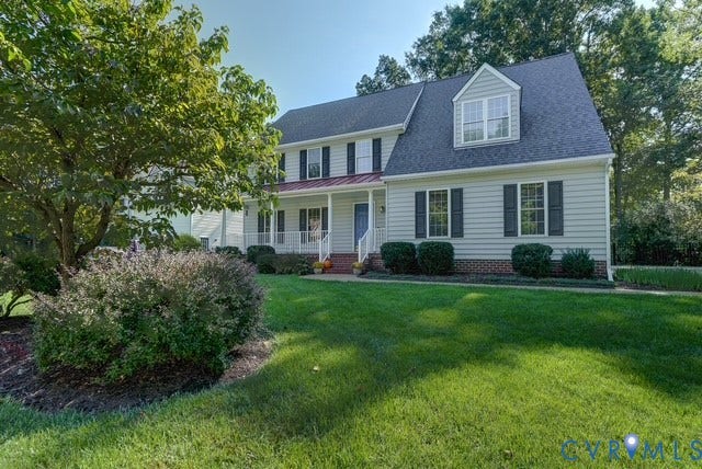 8113 Ainsdale Lane, Chesterfield, VA 23832 Two-story residence with dormer window, covered front porch, and mature trees