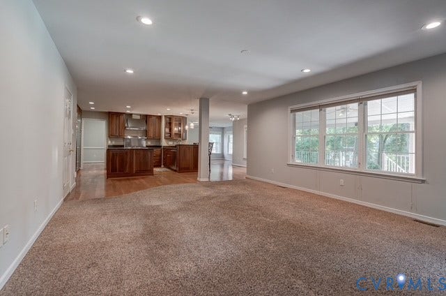 8113 Ainsdale Lane, Chesterfield, VA 23832 Recessed lighting illuminates the open-concept space featuring carpeting and wood-finish flooring
