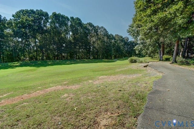 8113 Ainsdale Lane, Chesterfield, VA 23832 Expansive green space bordered by mature trees and a paved pathway