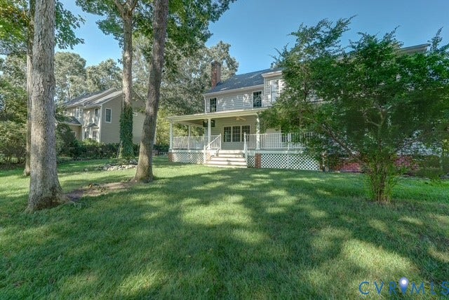 8113 Ainsdale Lane, Chesterfield, VA 23832 Expansive rear yard with mature trees and a covered porch featuring white railings