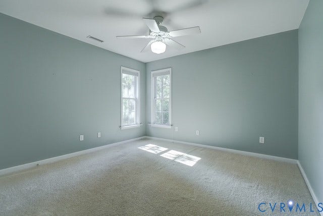 8113 Ainsdale Lane, Chesterfield, VA 23832 Carpeted room with two windows and a ceiling fan