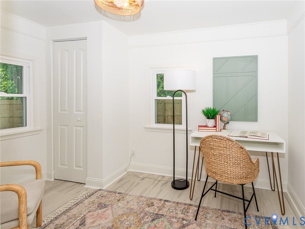 1601 N 25th Street, Richmond, VA 23223 Light-toned wood-finish flooring, white walls, and a two-panel bi-fold closet door