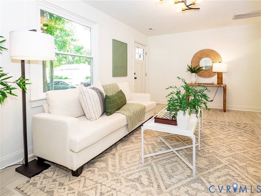 1601 N 25th Street, Richmond, VA 23223 Crisp white walls, large window, wood-finish flooring, and a contemporary ceiling light fixture