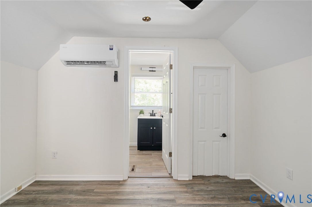 White walls with wood-finish flooring