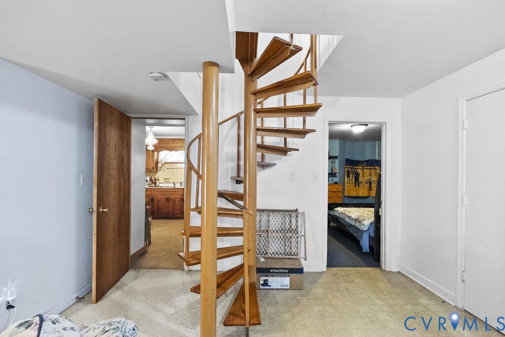 21 Vanderpool Lane, Detached, Cumberland, VA 23040 Wood-finish spiral staircase, light-toned resilient flooring, white walls, and a wood-finish door