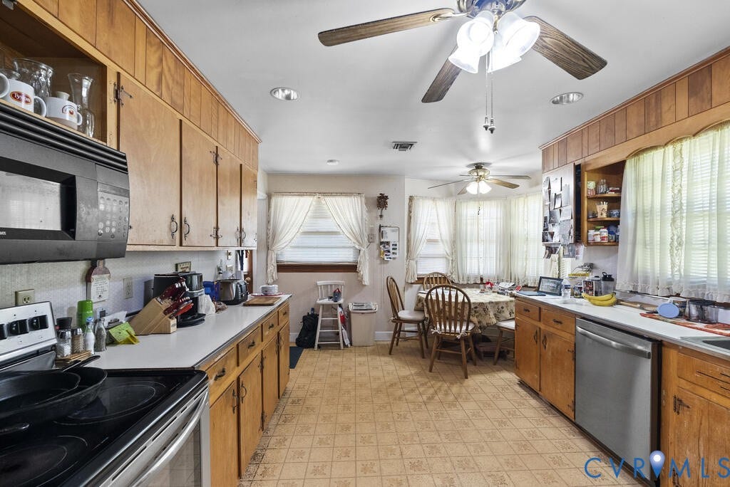 21 Vanderpool Lane, Detached, Cumberland, VA 23040 Kitchen featuring wood cabinetry, white countertops, built-in microwave, stainless steel dishwasher, and patterned flooring