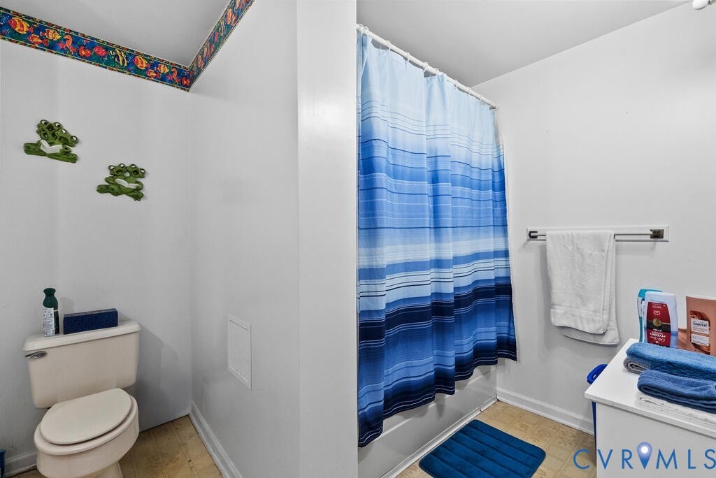 21 Vanderpool Lane, Detached, Cumberland, VA 23040 Full bathroom featuring a white toilet, white bathtub, and white vanity with a laminate countertop