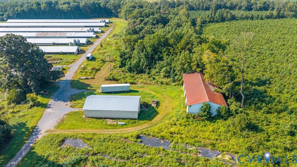 21 Vanderpool Lane, Detached, Cumberland, VA 23040 Multiple long-span buildings, a large open-sided structure, a single-story building with a red roof, and expansive surrounding green space