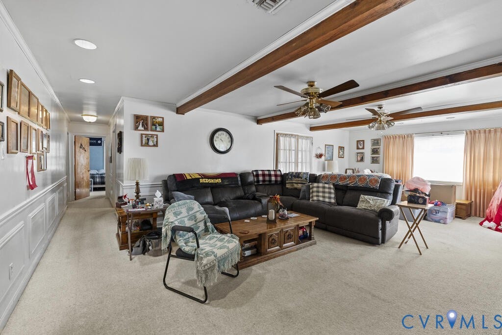 21 Vanderpool Lane, Detached, Cumberland, VA 23040 Spacious living area featuring exposed ceiling beams, recessed lighting, and wall paneling