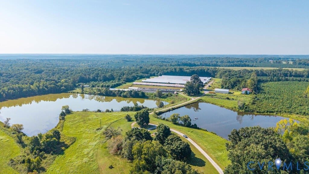 21 Vanderpool Lane, Detached, Cumberland, VA 23040 Expansive property with two ponds, surrounding mature trees, and agricultural structures