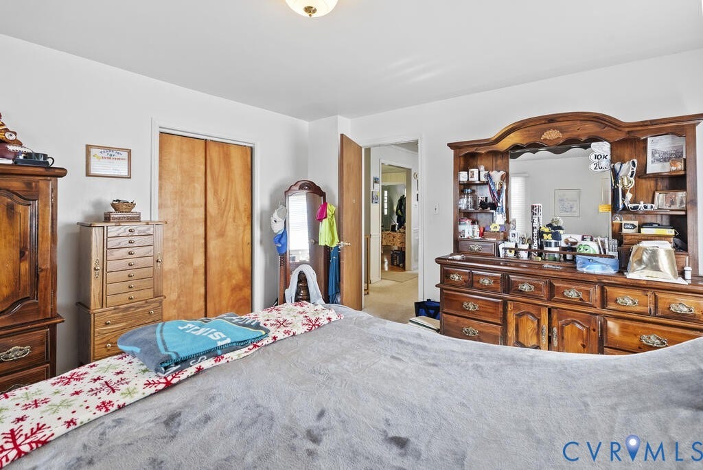 21 Vanderpool Lane, Detached, Cumberland, VA 23040 Wood-finish bi-fold closet doors, ceiling-mounted light fixture, and neutral wall tones