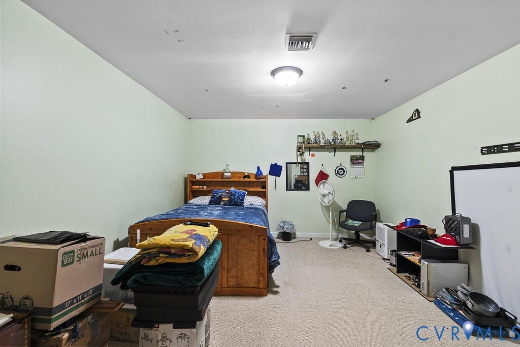 21 Vanderpool Lane, Detached, Cumberland, VA 23040 Carpeted room with light-colored walls and a built-in ceiling light fixture