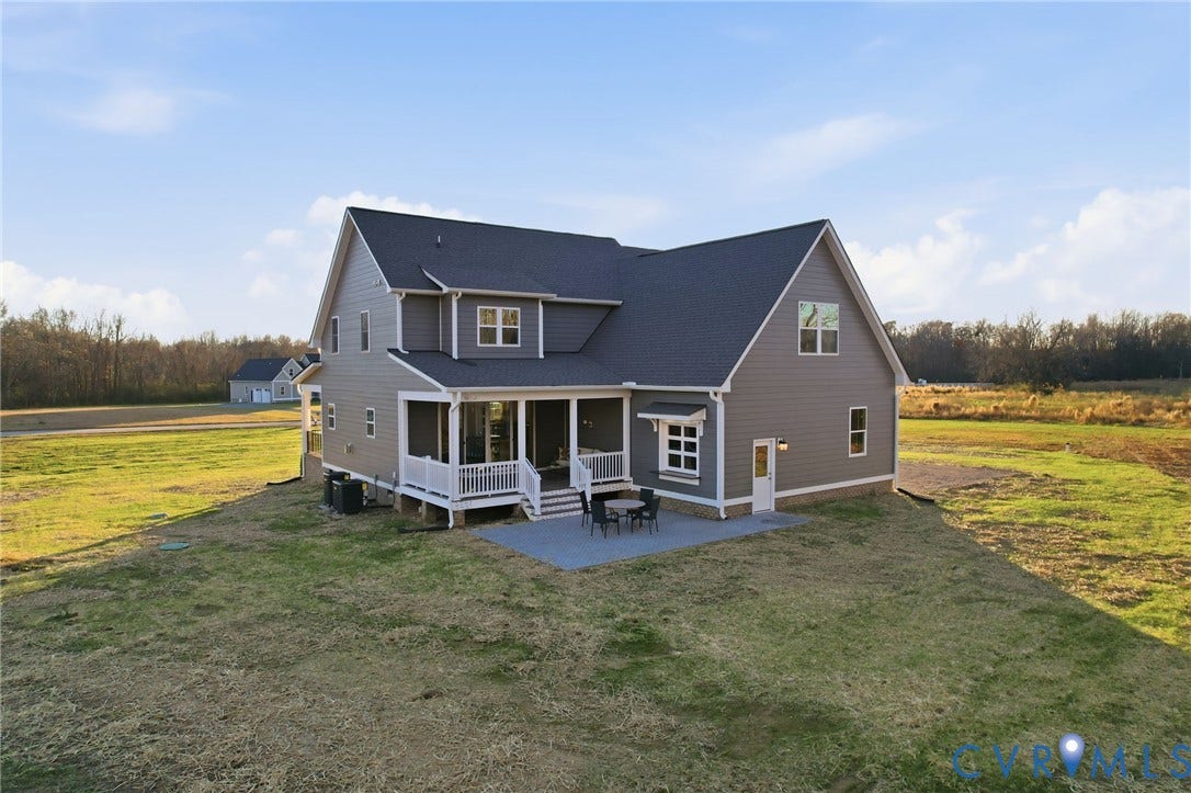 9169 Terroir Lane, Villas, New Kent, VA 23124 Two-story home with gray siding, dark shingle roof, and white trim
