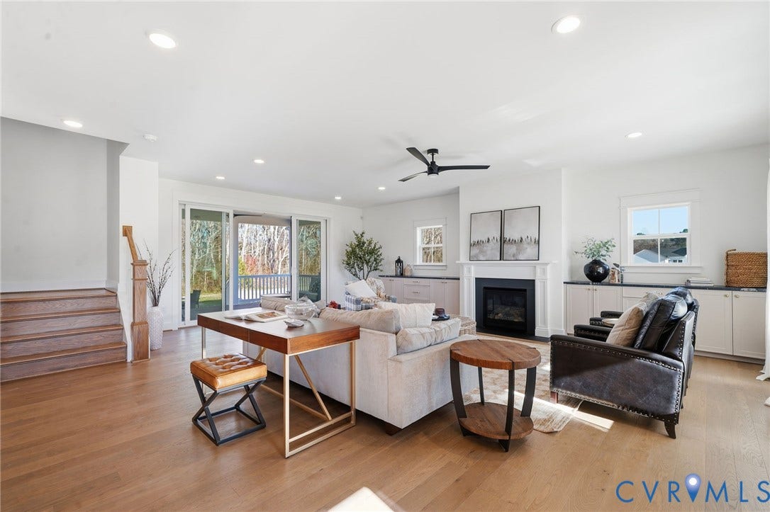 9169 Terroir Lane, Villas, New Kent, VA 23124 Expansive living area with wood-finish flooring, recessed lighting, and a modern ceiling fan
