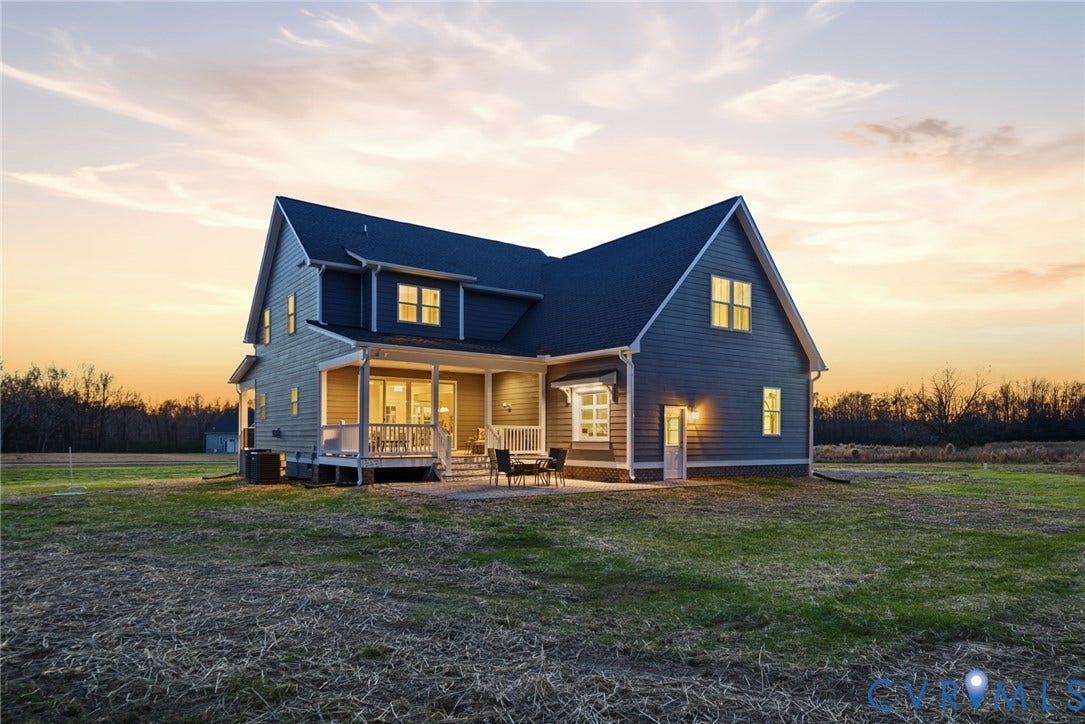 9169 Terroir Lane, Villas, New Kent, VA 23124 Two-story exterior with siding, a dark roof, a covered porch, and a patio area