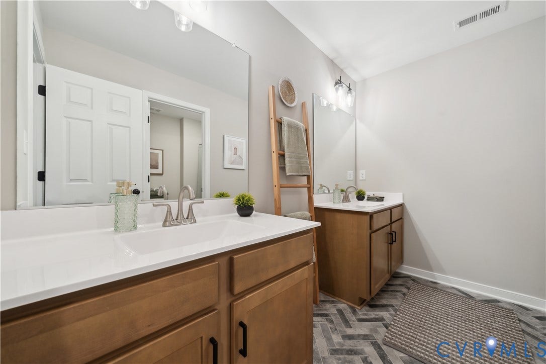 9102 Terroir Lane, Viniterra Villas, New Kent, VA 23124 Dual vanities with white countertops, under-mount sinks, and brushed nickel faucets