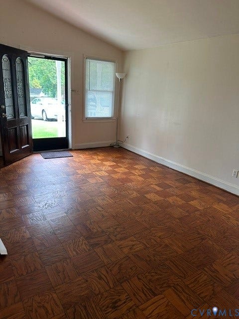 7617 Sunny Bank Drive, Henrico, VA 23228 Entryway with a vaulted ceiling, wood-finish flooring, and a decorative paneled door